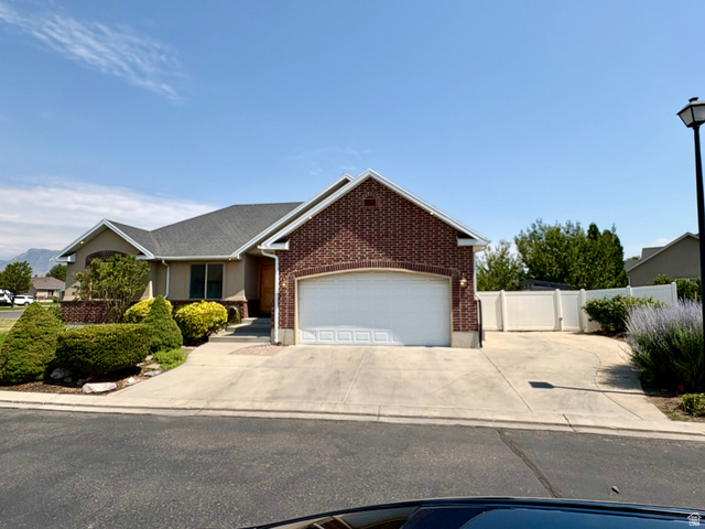 665 West State Road Lehi, UT 84043 - Photo 27 of 30 Brick and stucco exterior featuring a two-car garage