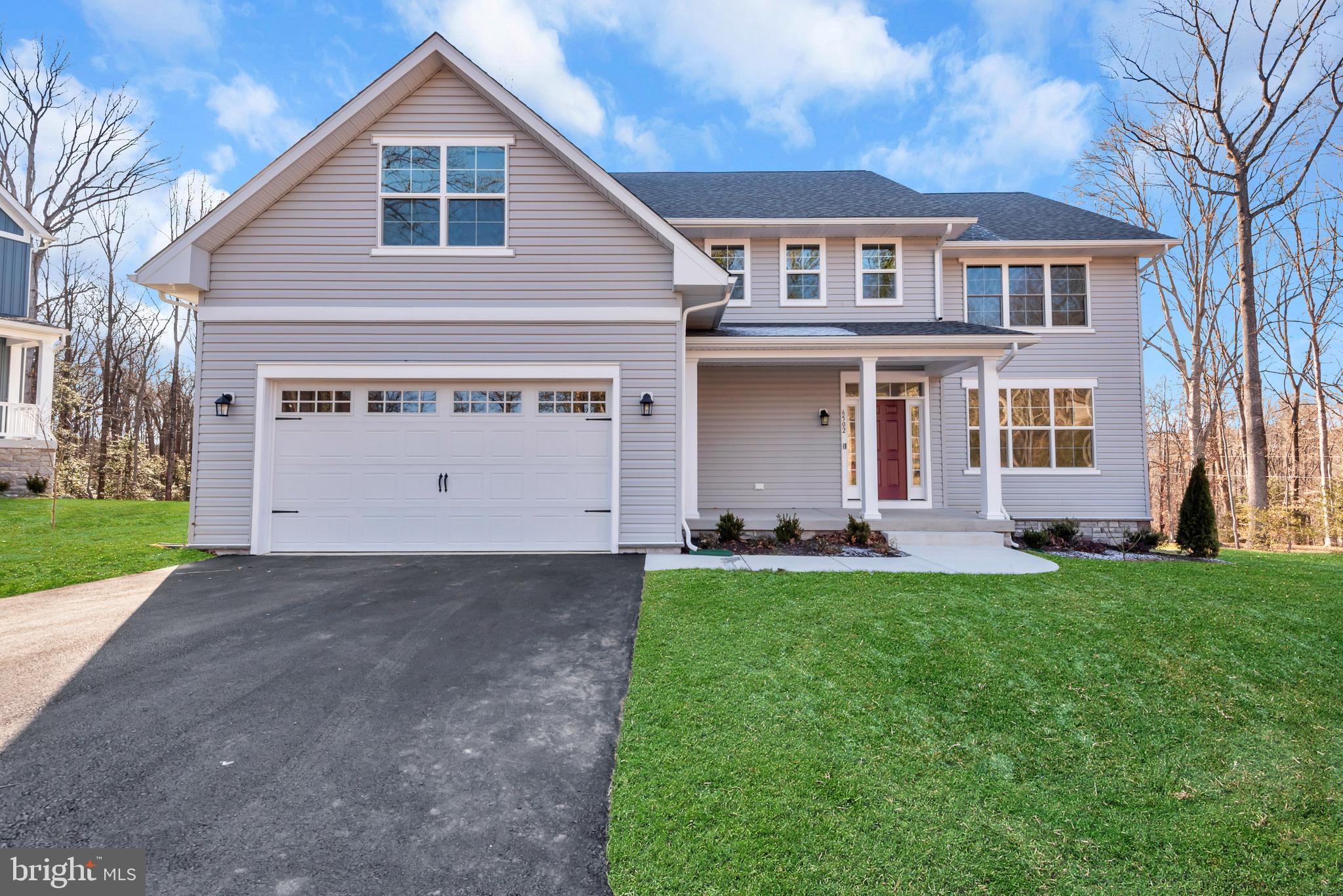 6502 Whitetail Xing Way Hanover, MD 21076 - Photo 1 of 58 a front view of a house with a yard