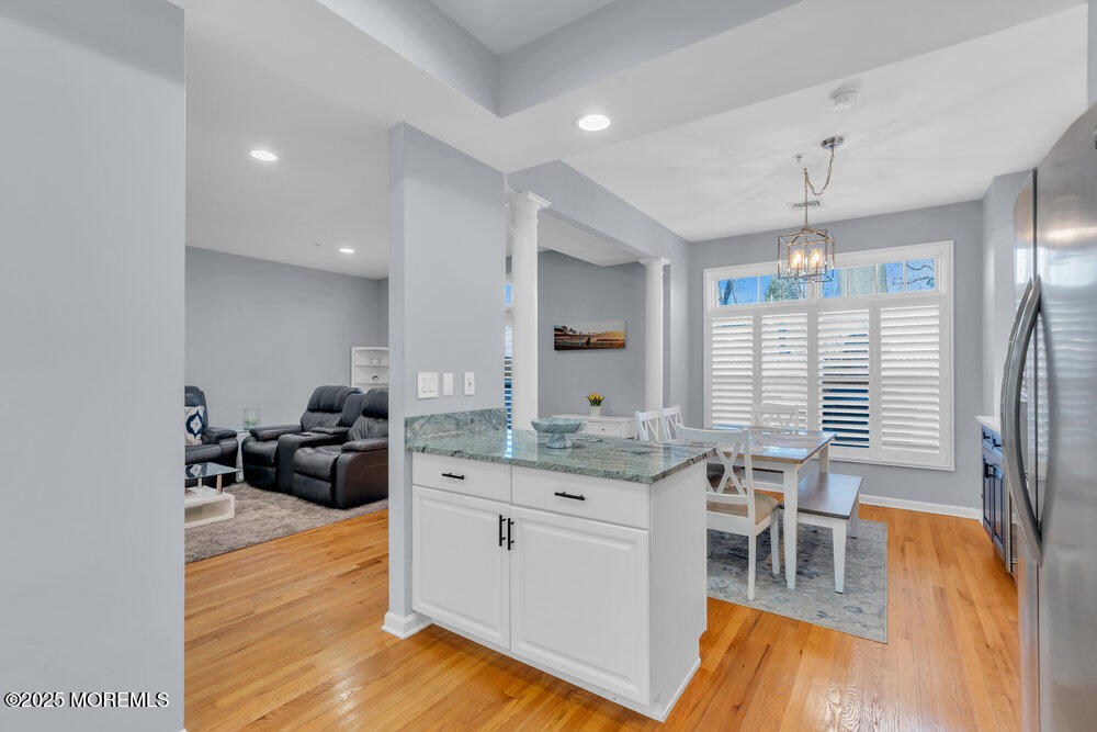 162 Main Street Manasquan, NJ 08736 - Photo 14 of 52 a kitchen with stainless steel appliances granite countertop a stove and a wooden floors
