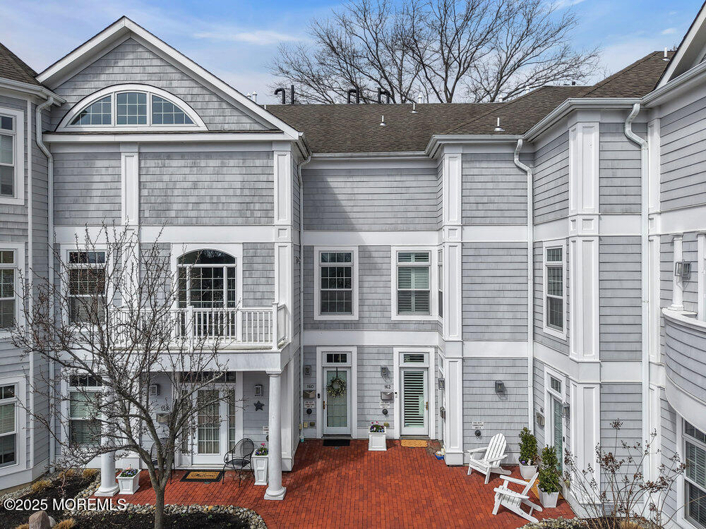 162 Main Street Manasquan, NJ 08736 - Photo 2 of 52 a front view of a house with street