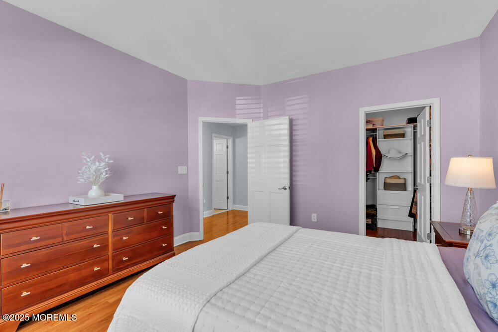162 Main Street Manasquan, NJ 08736 - Photo 23 of 52 a bedroom with a bed and a dresser in it