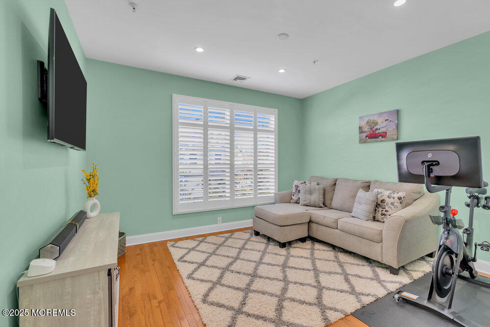162 Main Street Manasquan, NJ 08736 - Photo 25 of 52 a living room with furniture and a flat screen tv