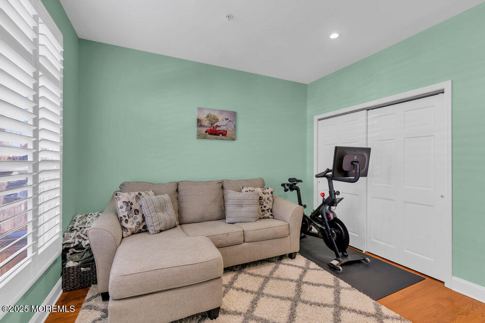 162 Main Street Manasquan, NJ 08736 - Photo 26 of 52 a living room with furniture and a flat screen tv