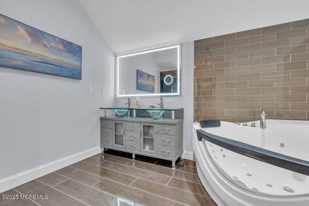 162 Main Street Manasquan, NJ 08736 - Photo 31 of 52 a bathroom with a sink and a bathtub