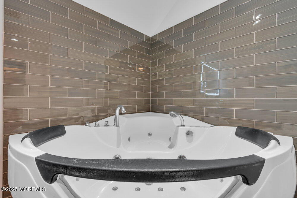 162 Main Street Manasquan, NJ 08736 - Photo 33 of 52 a bathroom with a bathtub