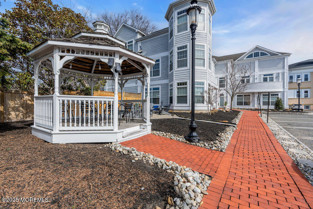 162 Main Street Manasquan, NJ 08736 - Photo 41 of 52 a view of a house with a porch