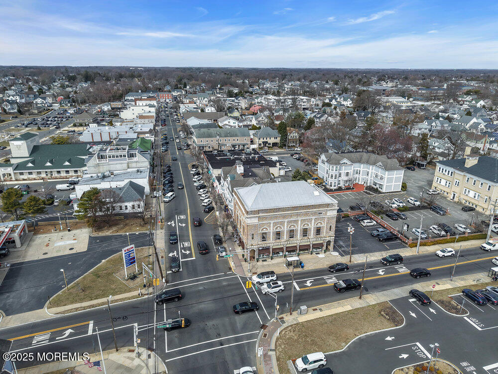 162 Main Street Manasquan, NJ 08736 - Photo 48 of 52 an aerial view of a city with parking