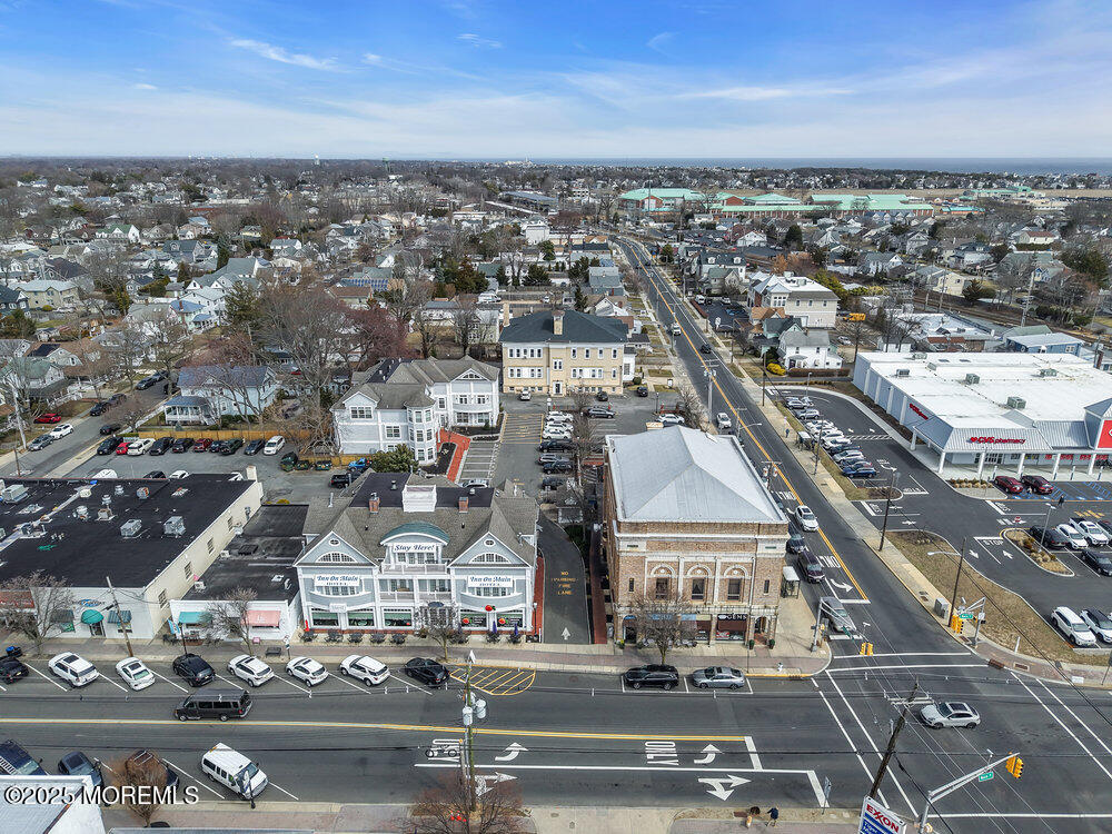 162 Main Street Manasquan, NJ 08736 - Photo 49 of 52 an aerial view of residential houses with city view