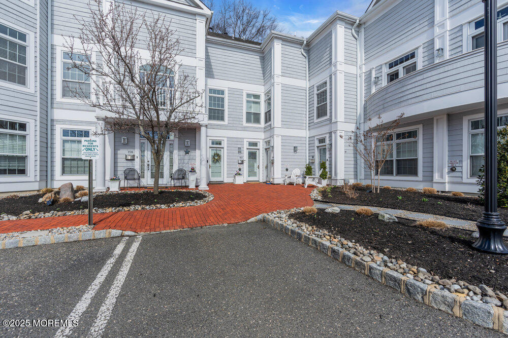 162 Main Street Manasquan, NJ 08736 - Photo 52 of 52 a view of a building with cars on road