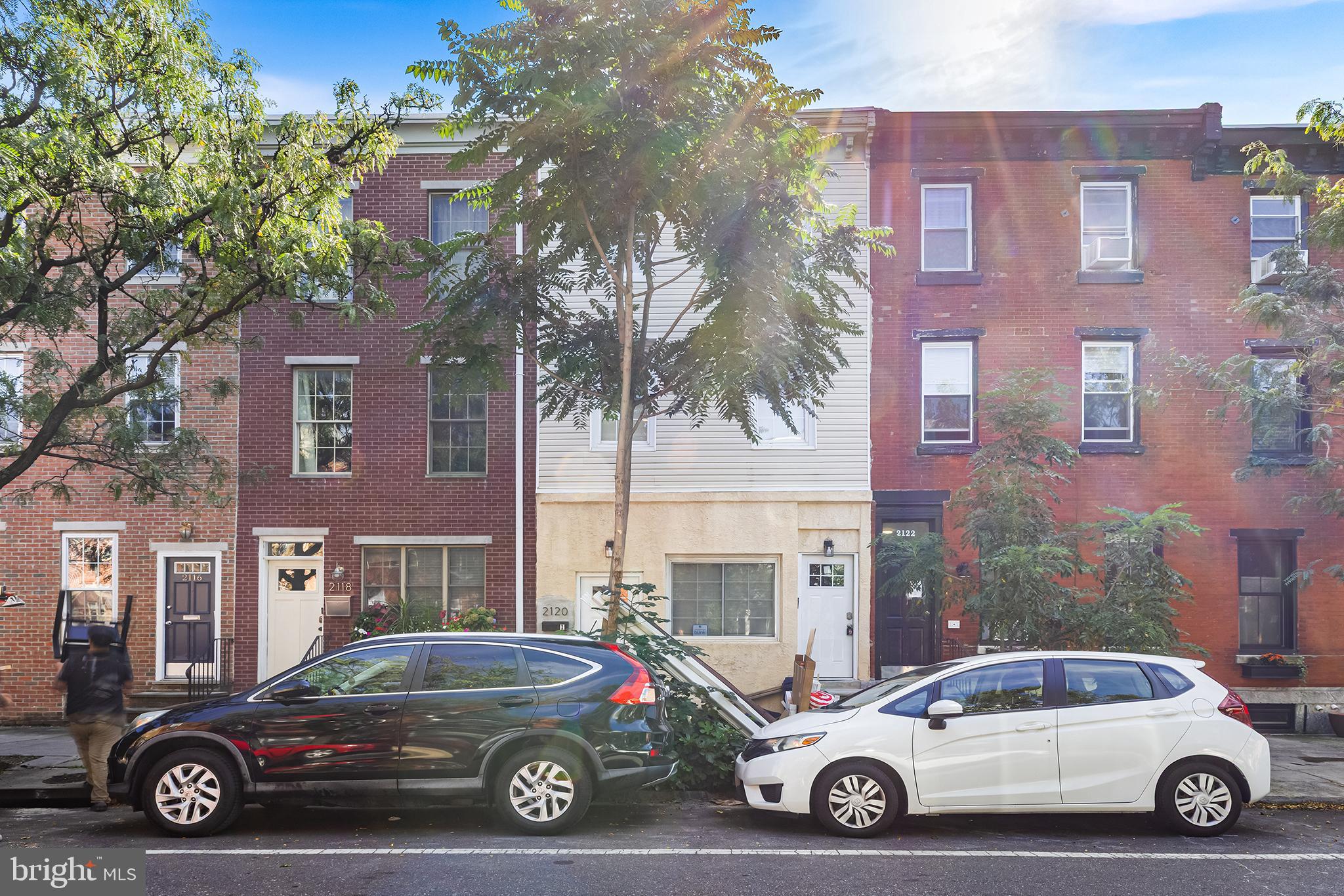 2120 Christian Street, Unit 2 Philadelphia, PA 19146 - Photo 10 of 10 a car parked in front of a brick house