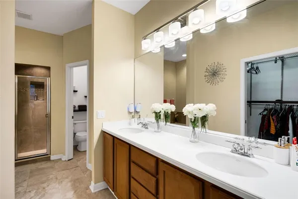 a bathroom with a double vanity sink mirror and double