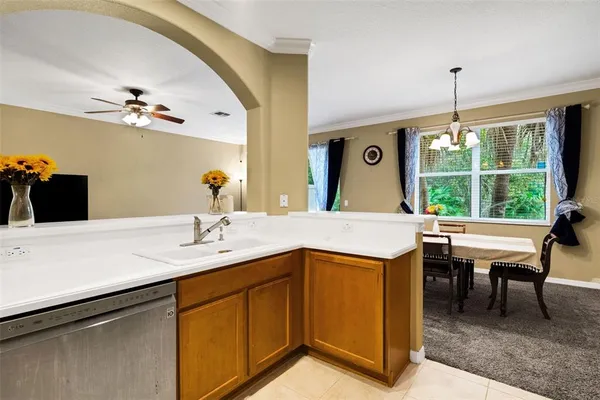 a kitchen with a stove a sink and a refrigerator
