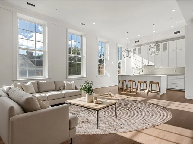 a living room with furniture and a table