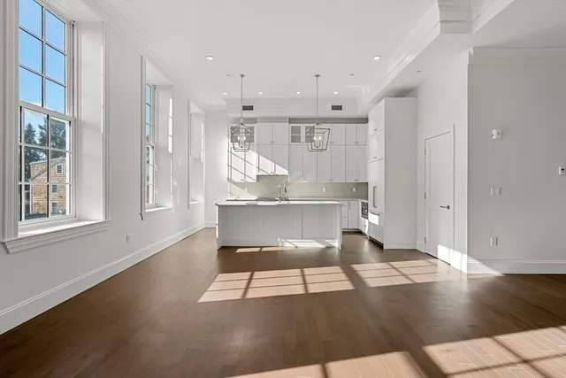 a view of kitchen with furniture and wooden floor