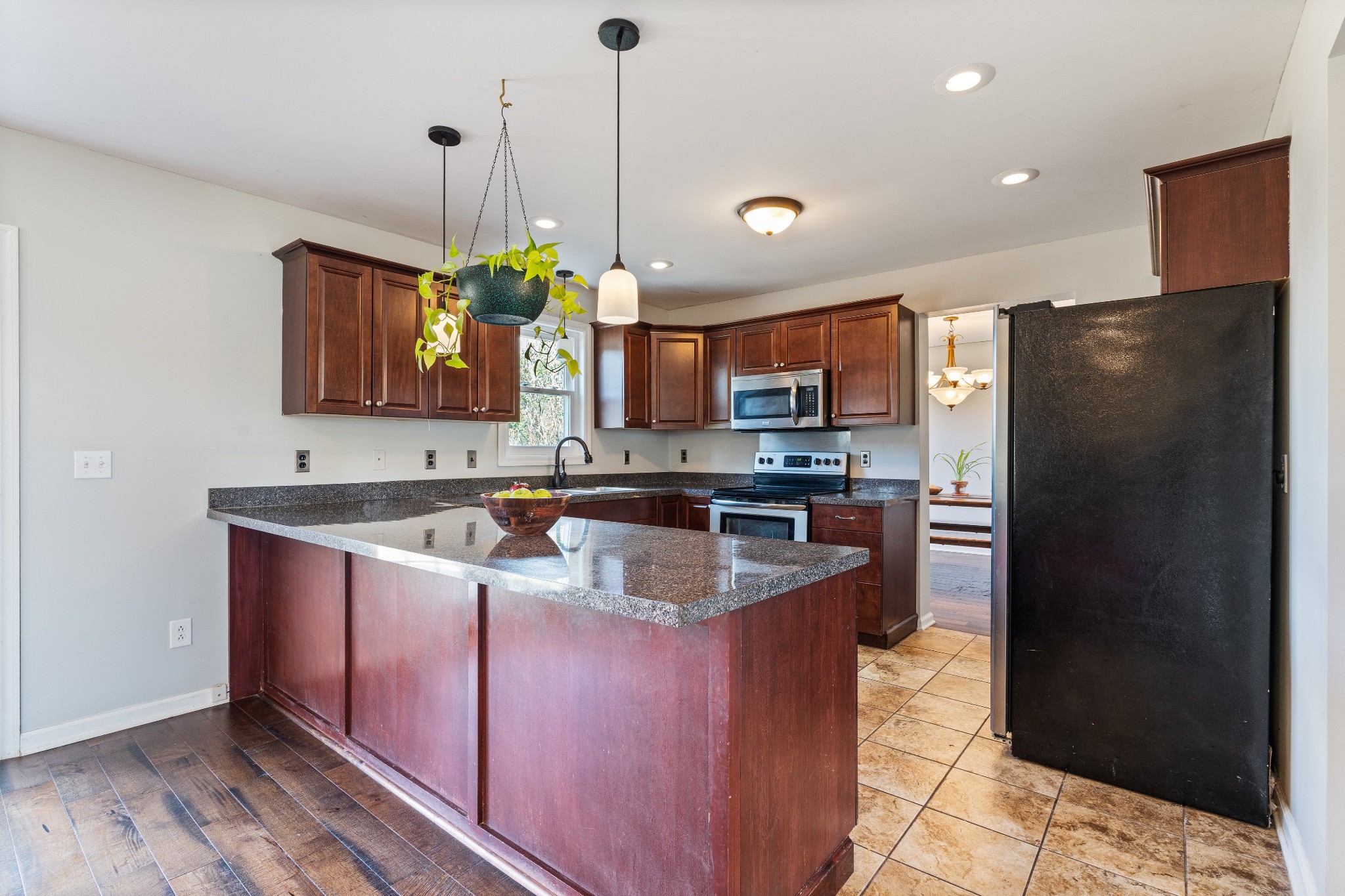 330 John Shaw Road Lewisburg, TN 37091 - Photo 13 of 41 a kitchen with stainless steel appliances granite countertop a sink a stove a refrigerator a center island and cabinets
