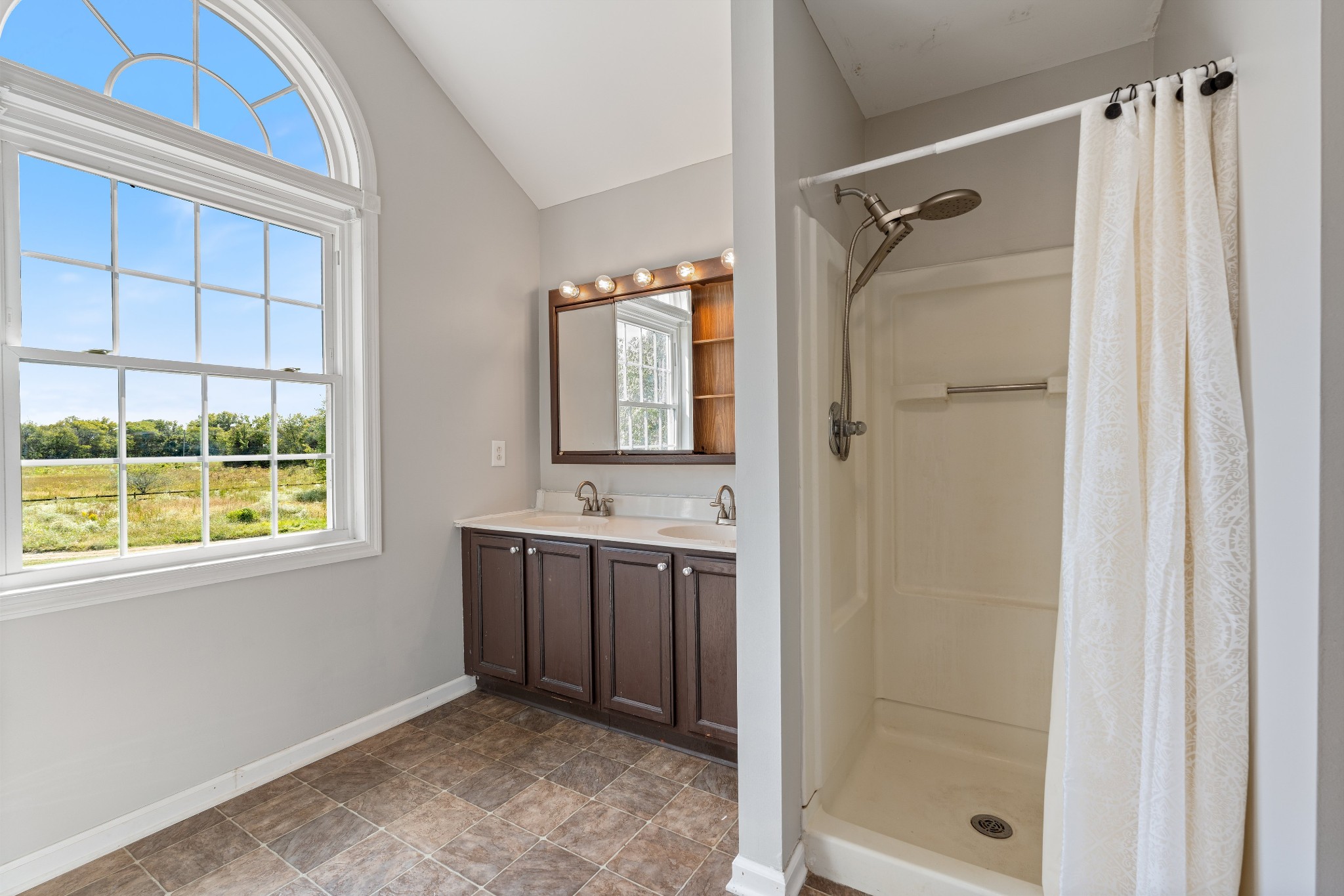 330 John Shaw Road Lewisburg, TN 37091 - Photo 30 of 41 a bathroom with a granite countertop sink a mirror and shower