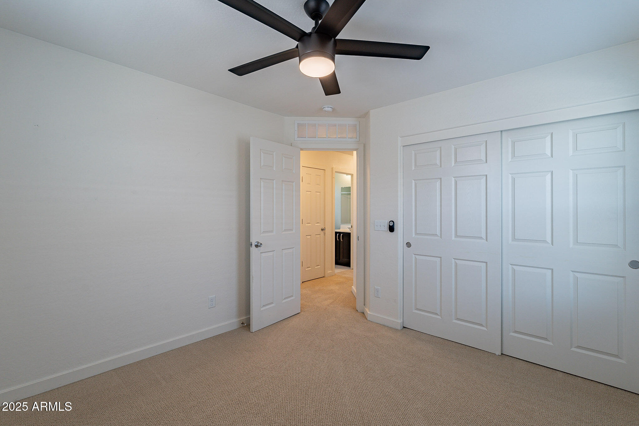 1061 South Hawk Lane Gilbert, AZ 85296 - Photo 20 of 23 an empty room with a ceiling fan and a window