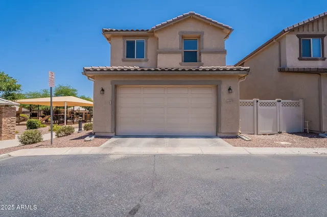 a front view of a house with garage