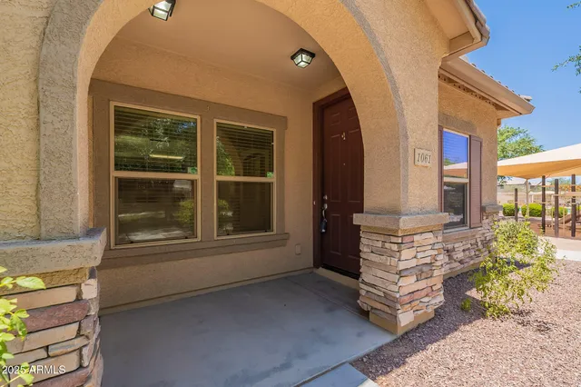 a view of front door of house with outdoor