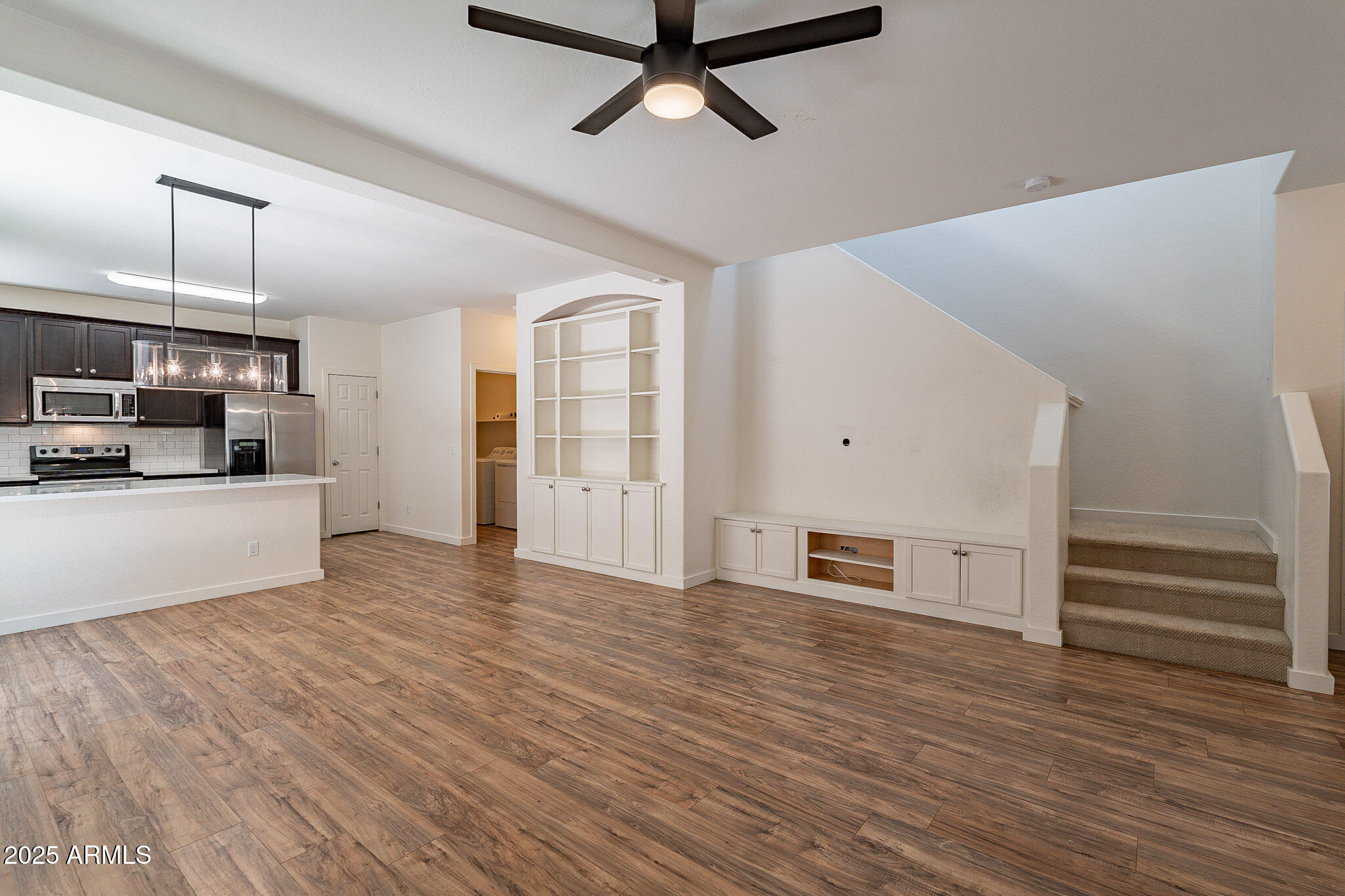 1061 South Hawk Lane Gilbert, AZ 85296 - Photo 5 of 23 a view of a kitchen with wooden floor and electronic appliances