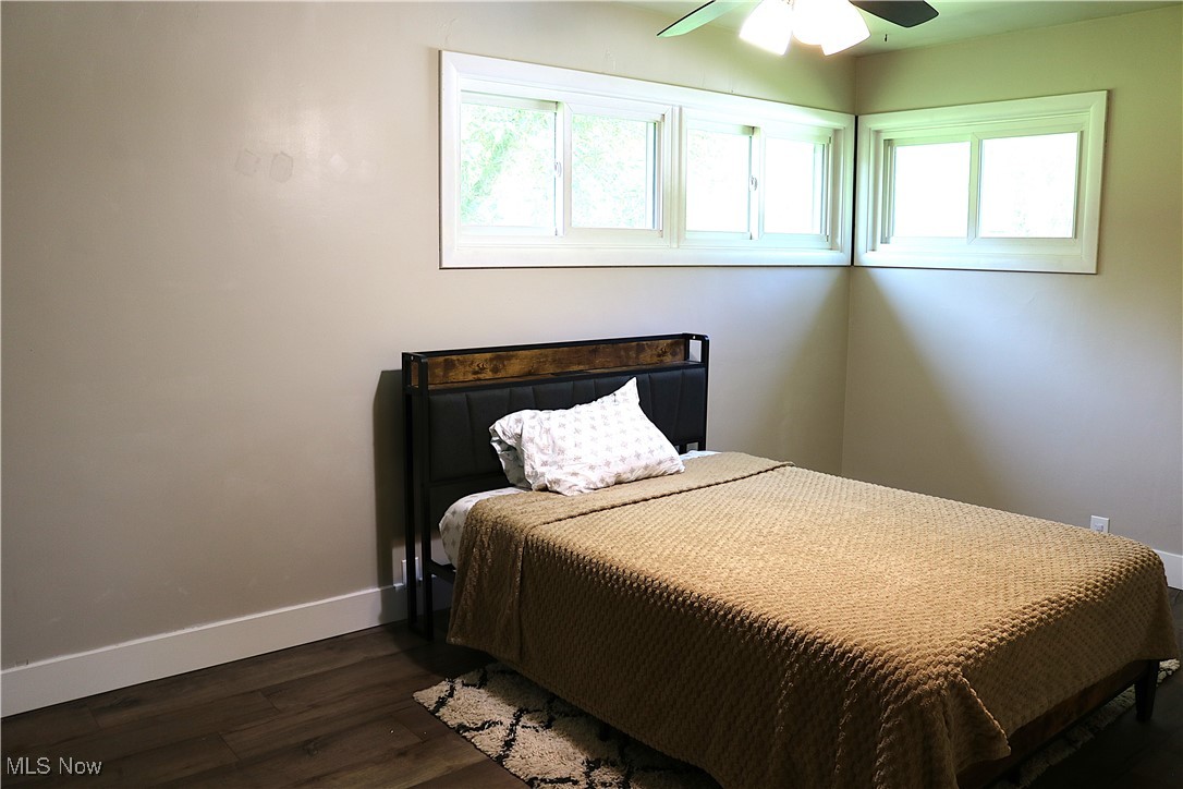 14485 Bass Lake Road Newbury, OH 44065 - Photo 22 of 22 Bedroom with dark wood-style flooring and ceiling fan