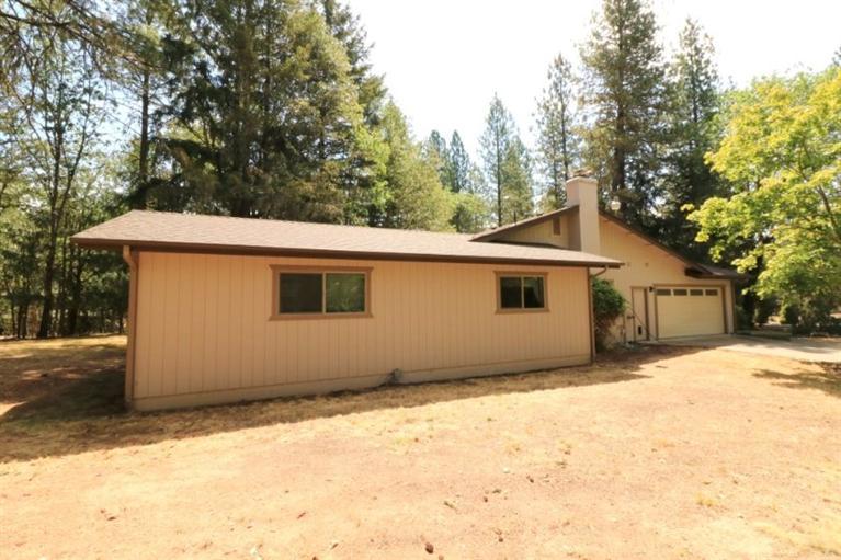 326 April Drive Merlin, OR 97532 - Photo 23 of 27 a house with trees in front of it