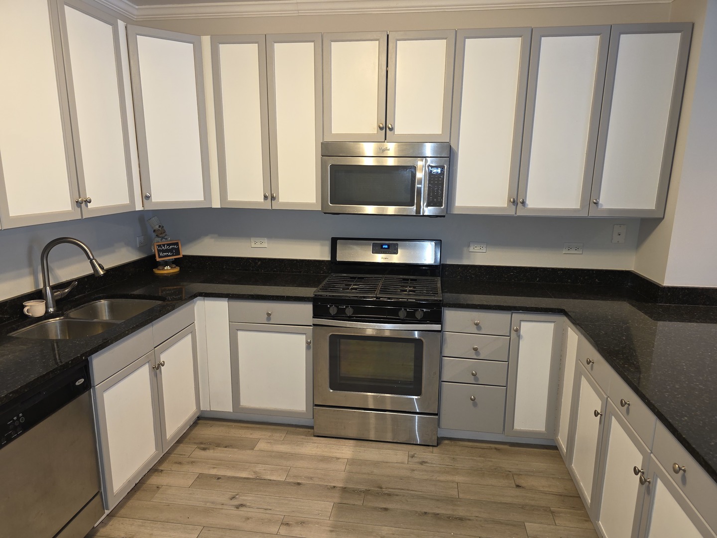 1101 South State Street, Unit 801 Chicago, IL 60605 - Photo 3 of 3 a kitchen with granite countertop a stove sink and cabinets