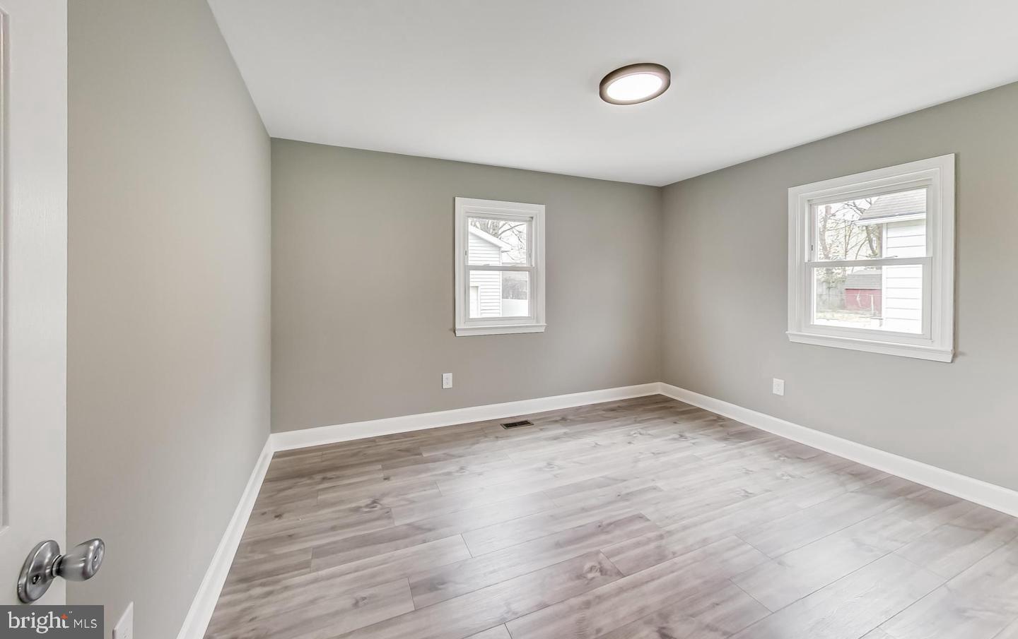 5923 Berwyn Road College Park, MD 20740 - Photo 12 of 51 an empty room with wooden floor and windows
