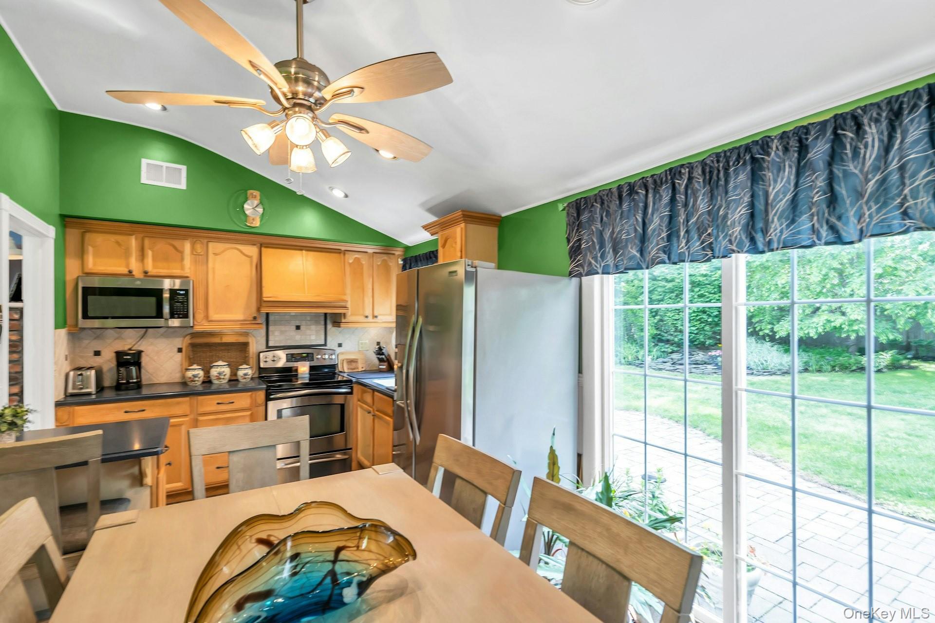 71 Ridge Haven Drive Ridge, NY 11961 - Photo 9 of 23 Kitchen With Sliders to Paver Patio
