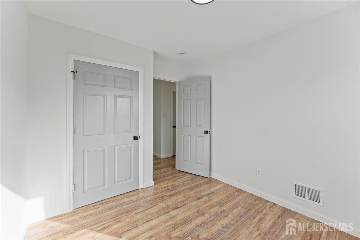 13 Lamont Court Sicklerville, NJ 08081 - Photo 16 of 25 a view of hallway with wooden floor