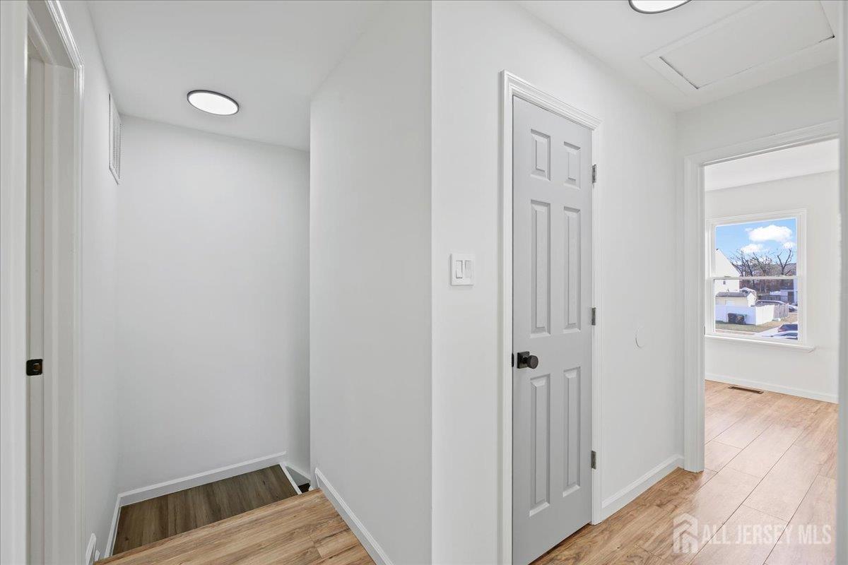 13 Lamont Court Sicklerville, NJ 08081 - Photo 17 of 25 a view of an empty room and wooden floor
