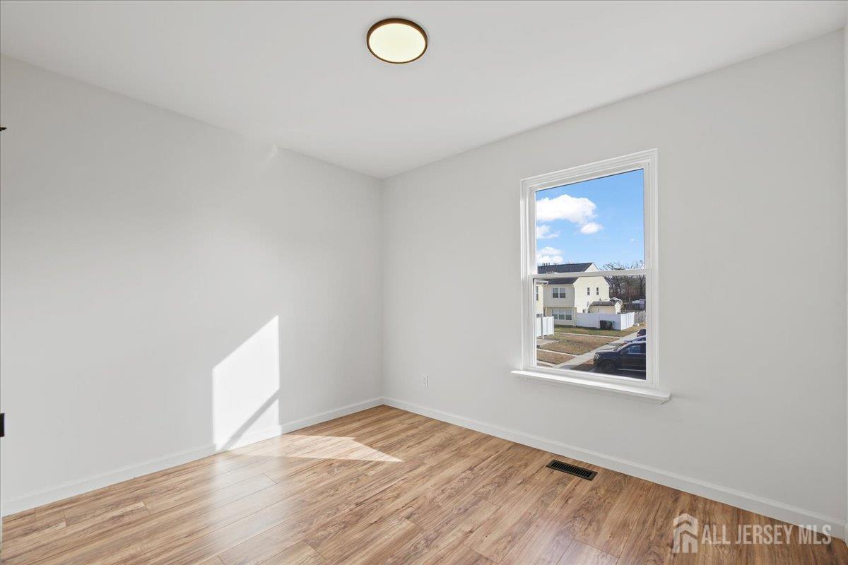 13 Lamont Court Sicklerville, NJ 08081 - Photo 22 of 25 a view of empty room with wooden floor