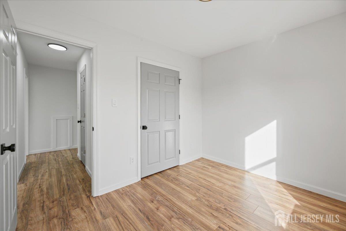 13 Lamont Court Sicklerville, NJ 08081 - Photo 23 of 25 a view of a room with wooden floor and a bathroom