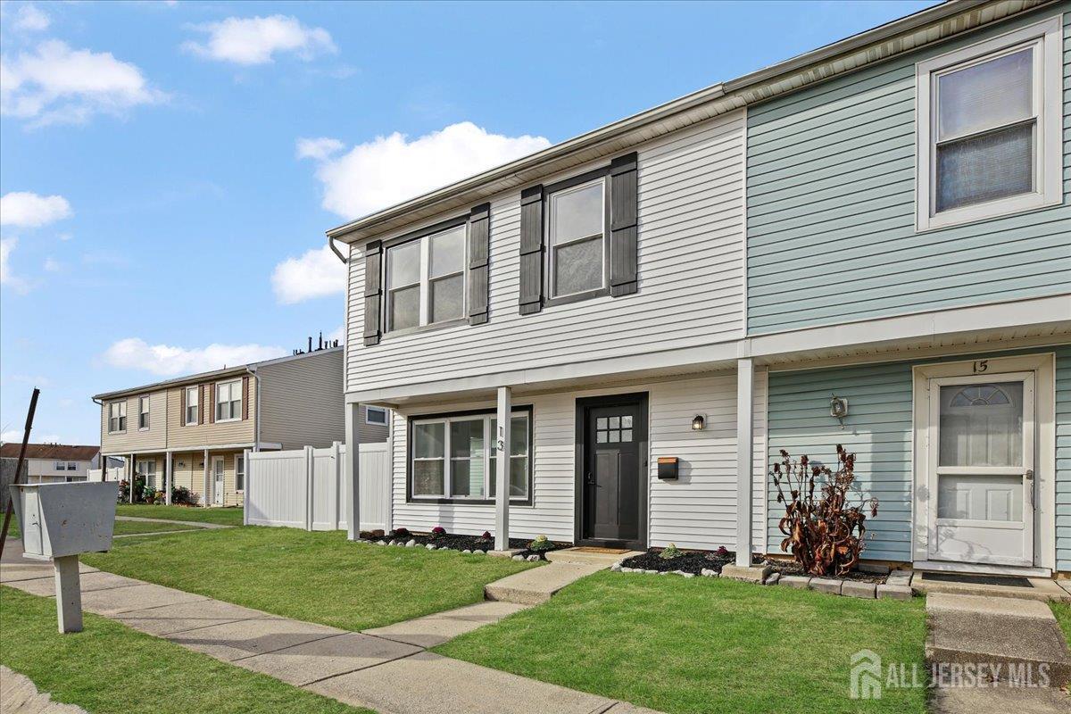 13 Lamont Court Sicklerville, NJ 08081 - Photo 4 of 25 a front view of a house with a yard and trees