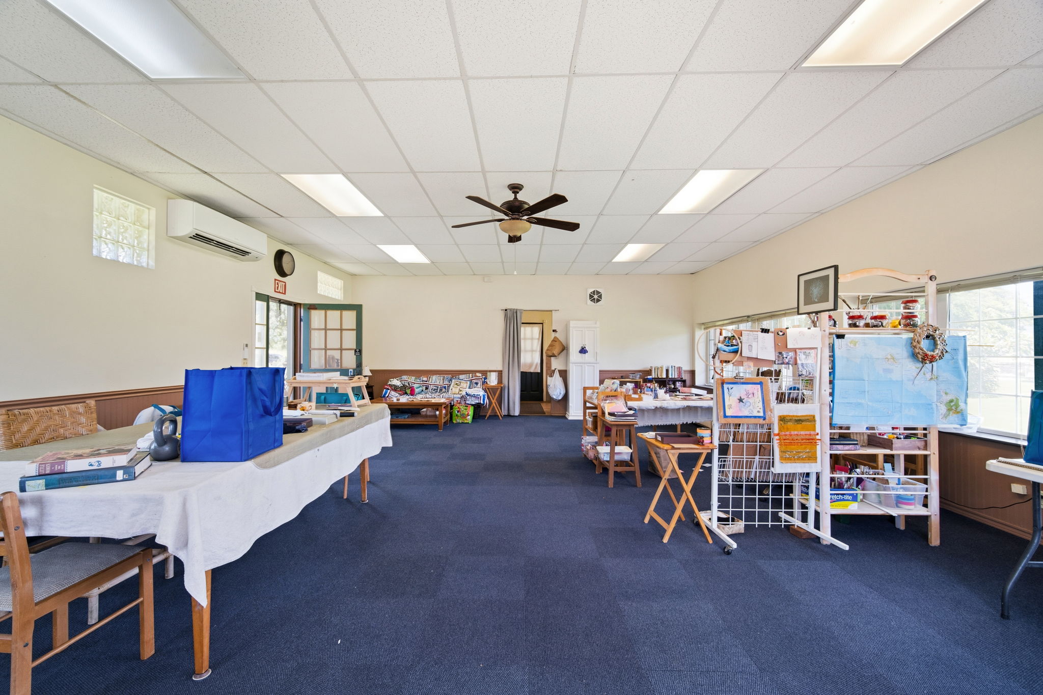 8297 Kekaha Road Kekaha, HI 96752 - Photo 11 of 27 a living room with lots of furniture and a chandelier