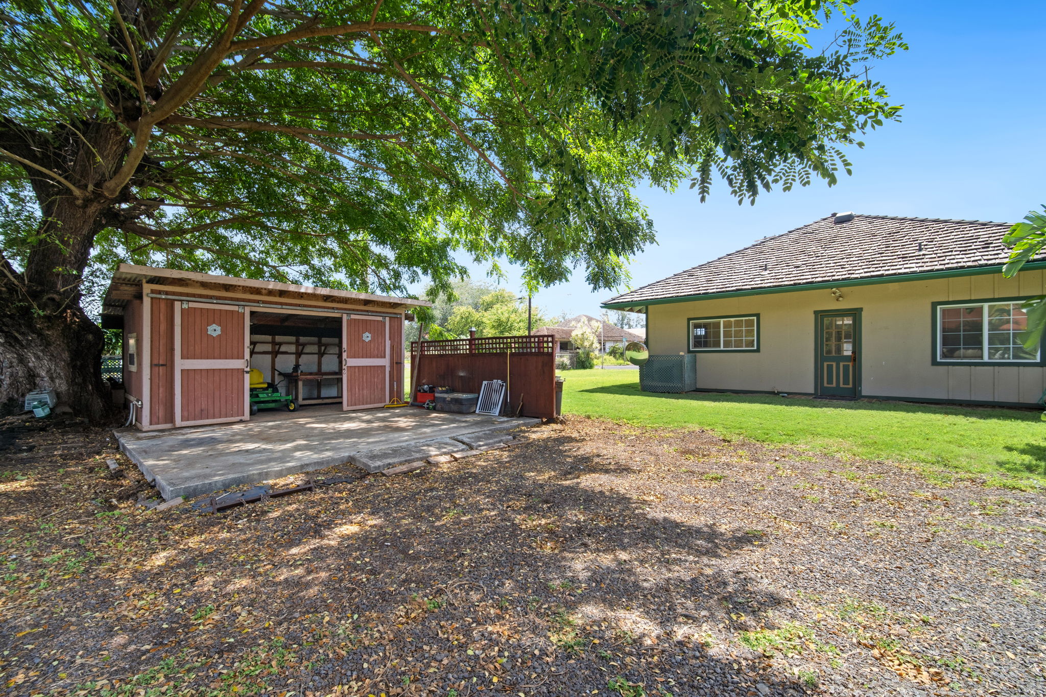 8297 Kekaha Road Kekaha, HI 96752 - Photo 15 of 27 a front view of a house with a garden and yard