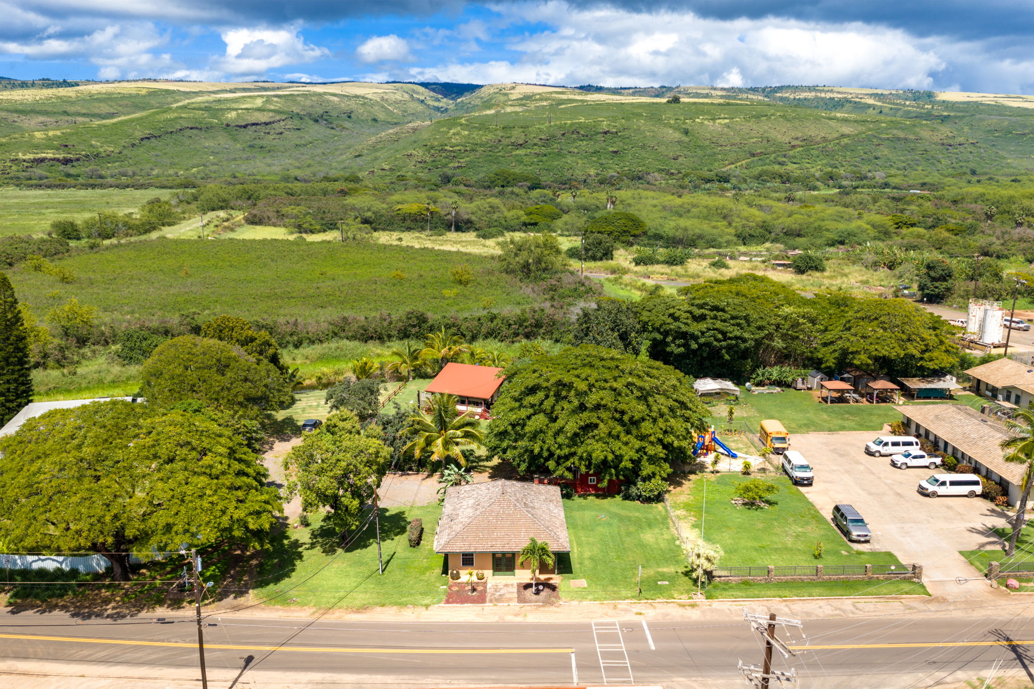 8297 Kekaha Road Kekaha, HI 96752 - Photo 25 of 27 an aerial view of residential houses with outdoor space and trees