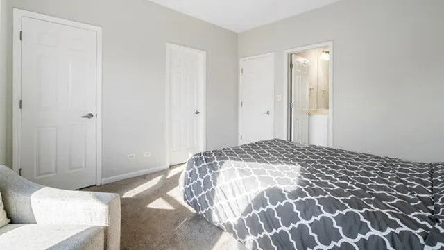 a bedroom with a bed and a walk in closet