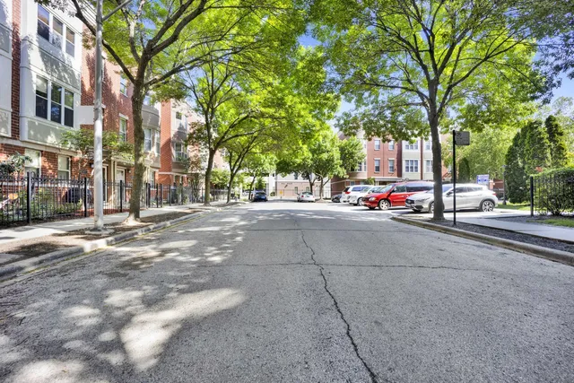 a view of street with parked cars