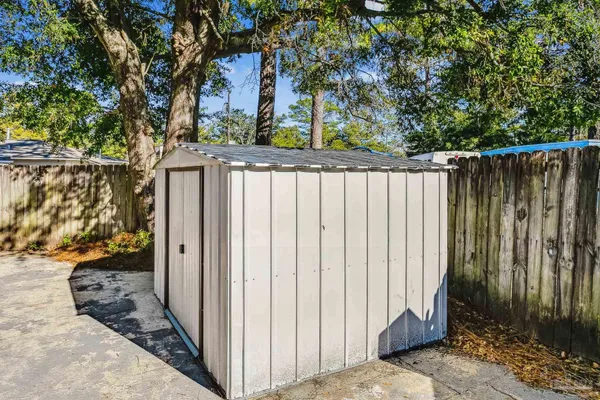 a view of a house with swimming pool and sitting area