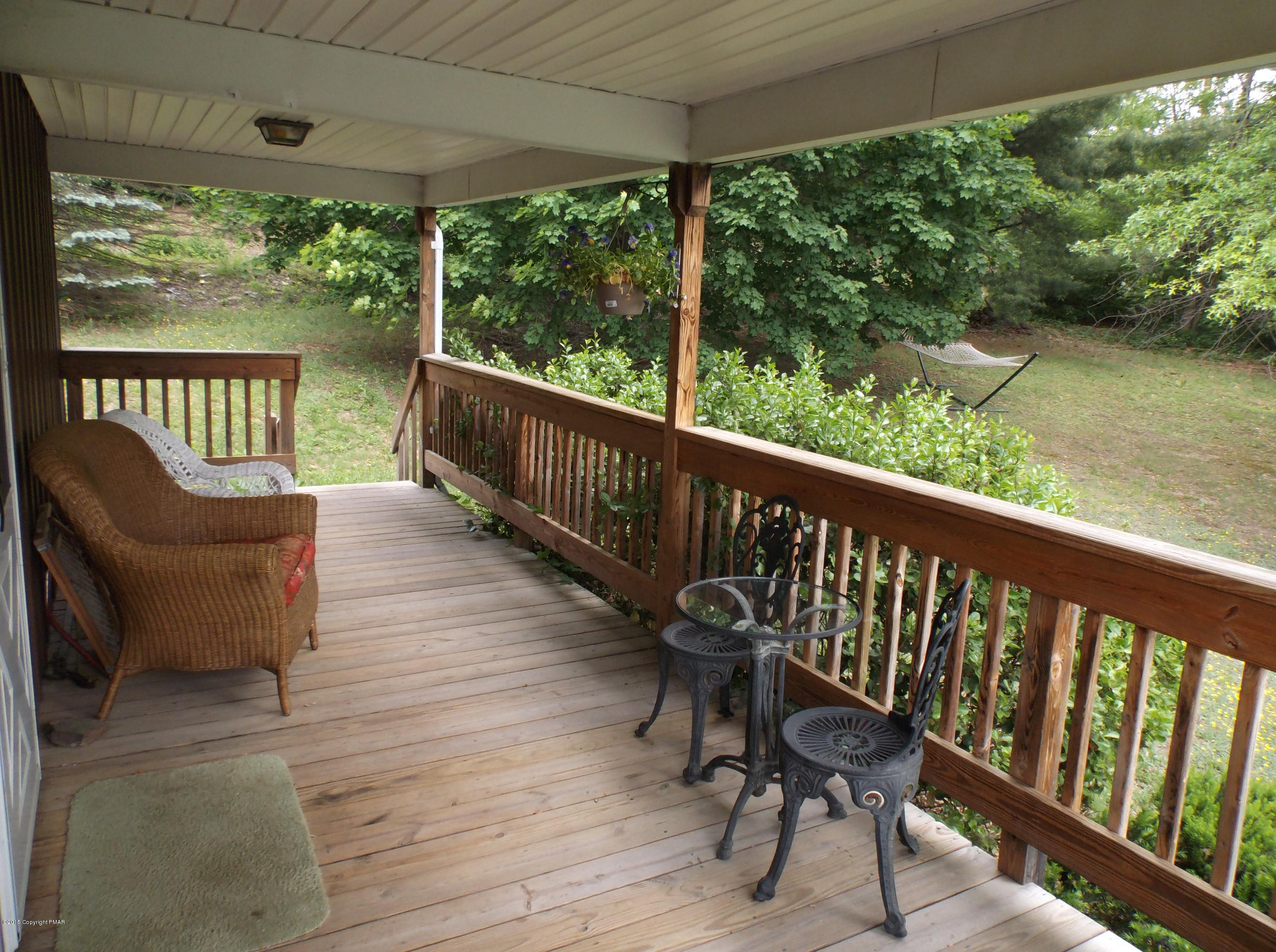 3430 Walnut Road Kunkletown, PA 18058 - Photo 13 of 16 a view of a chair and table on the deck