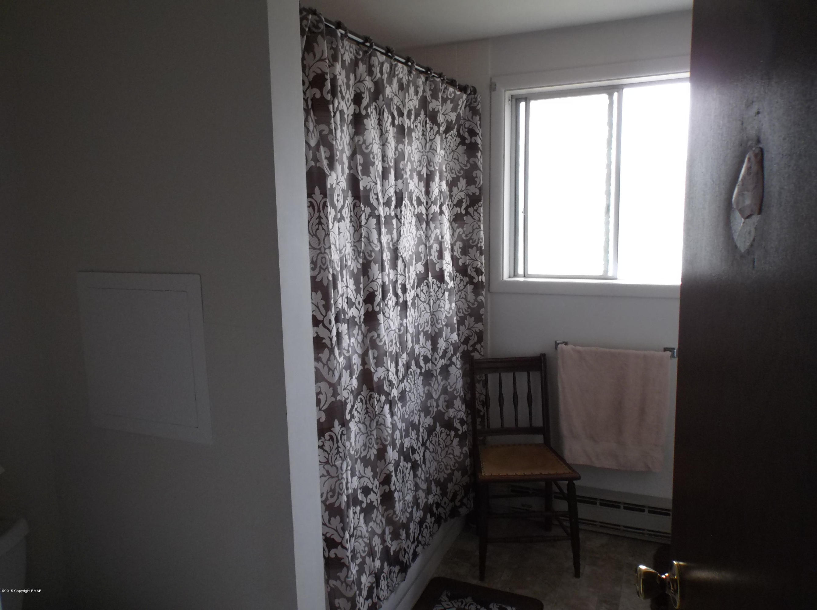 3430 Walnut Road Kunkletown, PA 18058 - Photo 5 of 16 a bathroom with a toilet and a window