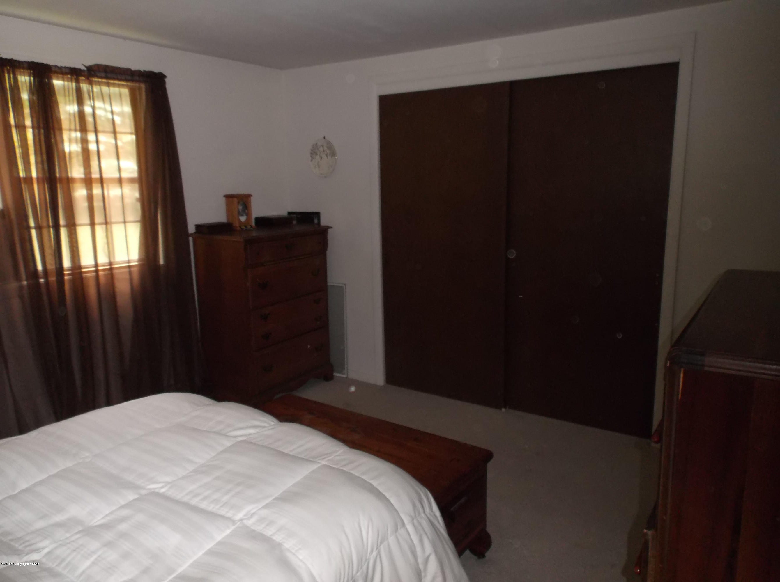 3430 Walnut Road Kunkletown, PA 18058 - Photo 9 of 16 a bedroom with a bed and a window