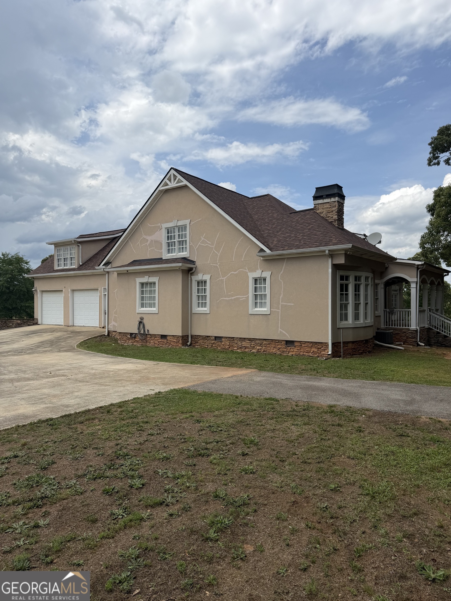 302 Norris Road Barnesville, GA 30204 - Photo 6 of 65 a front view of a house with a yard