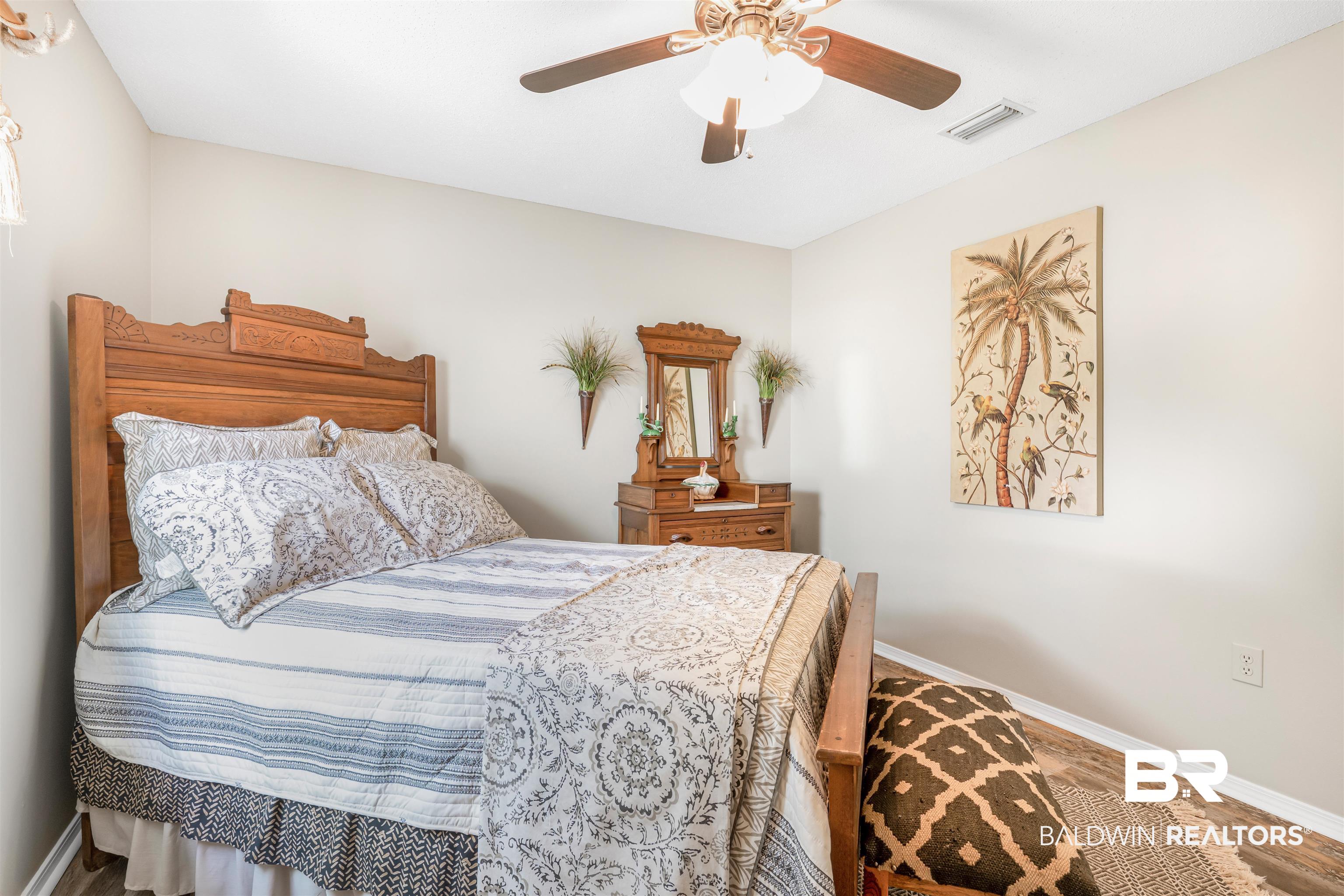 518 Ariel Avenue Foley, AL 36535 - Photo 27 of 47 Bedroom featuring hardwood / wood-style flooring and ceiling fan