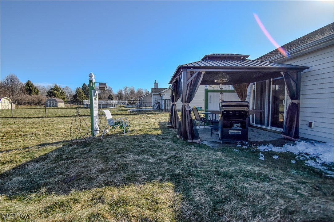 643 Wood Ridge Road Geneva, OH 44041 - Photo 20 of 24 View of yard with a gazebo, a patio, and fence