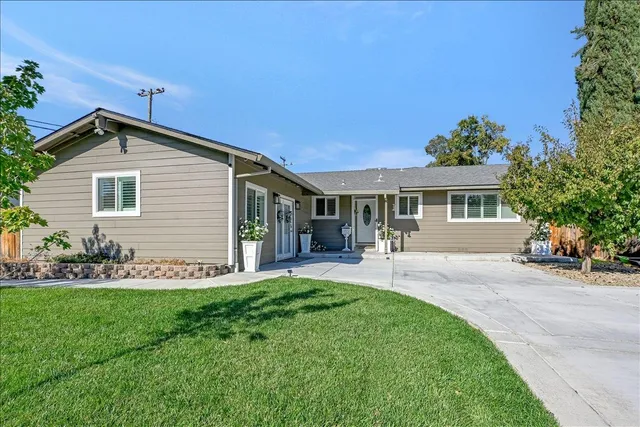 a front view of a house with a yard and porch