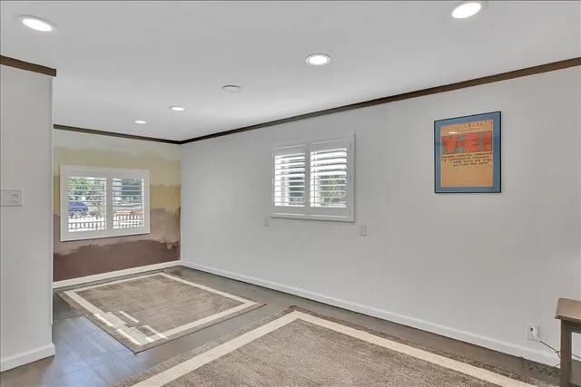 a view of a dining room with furniture wooden floor and chandelier