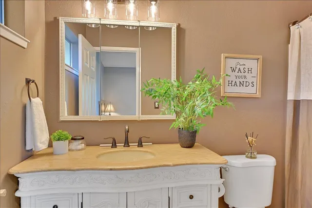 a view of a livingroom with a ceiling fan and a window