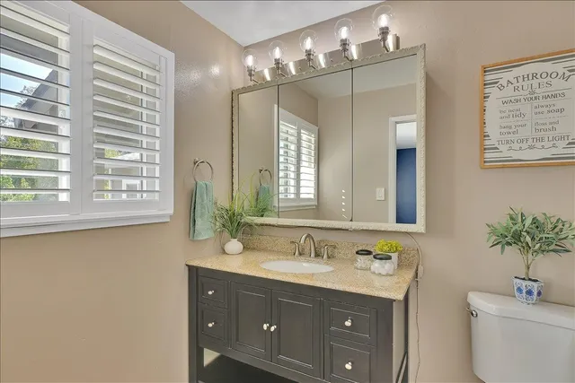 a view of a chair and table under an umbrella